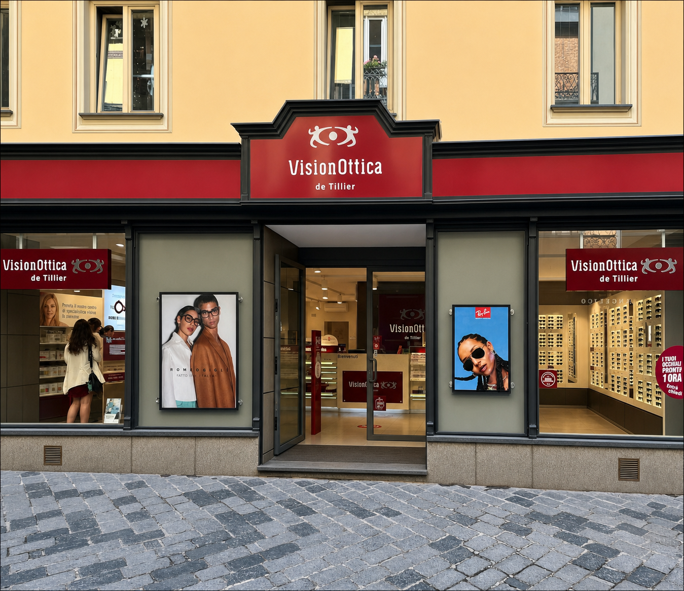 Facciata del negozio VisionOttica De Tillier di Aosta su via pedonale con insegna bordeaux, doppia vetrina con lightbox pubblicitari e porta a vetri centrale aperta